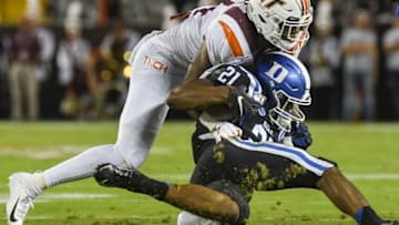 BLACKSBURG, VA - SEPTEMBER 27: Running back Mataeo Durant #21 of the Duke Blue Devils is hit by linebacker Alan Tisdale #34 of the Virginia Tech Hokies in the first half at Lane Stadium on September 27, 2019 in Blacksburg, Virginia. (Photo by Michael Shroyer/Getty Images)