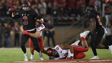 PALO ALTO, CA - OCTOBER 06: K.J. Costello #3 of the Stanford Cardinal gets sacked by Chase Hansen #22 of the Utah Utes during the first quarter of their NCAA football game at Stanford Stadium on October 6, 2018 in Palo Alto, California. (Photo by Thearon W. Henderson/Getty Images)