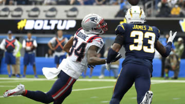INGLEWOOD, CALIFORNIA - OCTOBER 31: Kendrick Bourne #84 of the New England Patriots attempts to catch a pass while being guarded by Derwin James Jr. #33 of the Los Angeles Chargers at SoFi Stadium on October 31, 2021 in Inglewood, California. (Photo by Kevork Djansezian/Getty Images)