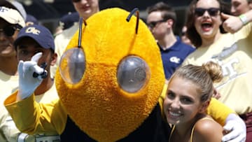 ATLANTA, GA - SEPTEMBER 23: Georgia Tech Yellow Jackets mascot Buzz poses with a fan holding a fidget spinner during the game against the Pittsburgh Panthers at Bobby Dodd Stadium on September 23, 2017 in Atlanta, Georgia. (Photo by Mike Zarrilli/Getty Images)