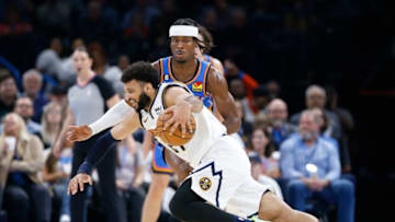 OKC Thunder guard Shai Gilgeous-Alexander (2) defends Denver Nuggets guard Jamal Murray (27): Alonzo Adams-USA TODAY Sports
