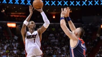Oct 29, 2014; Miami, FL, USA; Miami Heat forward Chris Bosh (1) shoots over Washington Wizards center Marcin Gortat (4) during the second half at American Airlines Arena. Miami won 107-95. Mandatory Credit: Steve Mitchell-USA TODAY Sports
