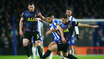 BRIGHTON, ENGLAND - MARCH 16: Neal Maupay of Brighton & Hove Albion and Ben Davies of Tottenham Hotspur battle for the ball during the Premier League match between Brighton & Hove Albion and Tottenham Hotspur at American Express Community Stadium on March 16, 2022 in Brighton, England. (Photo by Charlie Crowhurst/Getty Images)