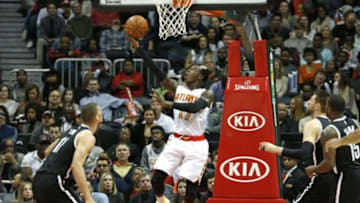 Jan 16, 2016; Atlanta, GA, USA; Atlanta Hawks guard Dennis Schroder (17) shoots a reverse layup in the second quarter against the Brooklyn Nets at Philips Arena. Mandatory Credit: Jason Getz-USA TODAY Sports