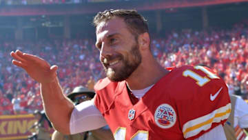 Sep 11, 2016; Kansas City, MO, USA; Kansas City Chiefs quarterback Alex Smith (11) is congratulated by team mates after scoring the winning touchdown in overtime against the San Diego Chargers at Arrowhead Stadium. The Chiefs won 33-27 in overtime. Mandatory Credit: Denny Medley-USA TODAY Sports
