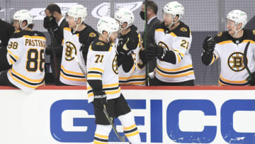 Apr 27, 2021; Pittsburgh, Pennsylvania, USA; Boston Bruins left wing Taylor Hall (71) is congratulated after scoring against the Pittsburgh Penguins during the third period at PPG Paints Arena. Mandatory Credit: Philip G. Pavely-USA TODAY Sports