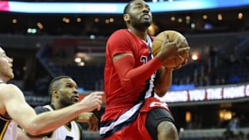 Feb 18, 2016; Washington, DC, USA; Washington Wizards guard John Wall (2) drives to the basket as Utah Jazz forward Trevor Booker (33) looks on during the first half at Verizon Center. Mandatory Credit: Brad Mills-USA TODAY Sports