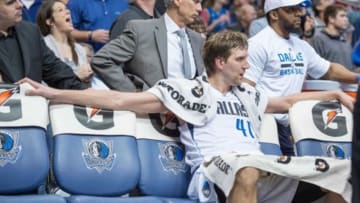 Feb 7, 2015; Dallas, TX, USA; Dallas Mavericks forward Dirk Nowitzki (41) sits on the bench during the game against the Portland Trail Blazers at the American Airlines Center. The Mavericks defeated the Trail Blazers 111-101 in overtime. Mandatory Credit: Jerome Miron-USA TODAY Sports