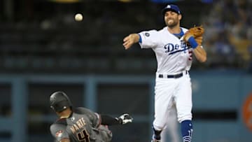 LOS ANGELES, CA - MARCH 30: Ketel Marte #4 of the Arizona Diamondbacks is caught by Chris Taylor #3 of the Los Angeles Dodgers in a double play in the fifth inning at Dodger Stadium on March 30, 2019 in Los Angeles, California. (Photo by John McCoy/Getty Images)
