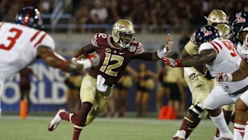 Sep 5, 2016; Orlando, FL, USA; Florida State Seminoles quarterback Deondre Francois (12) runs with the ball against the Mississippi Rebels during the first half at Camping World Stadium. Mandatory Credit: Kim Klement-USA TODAY Sports