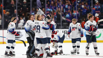 ANAHEIM, CALIFORNIA - FEBRUARY 08: The U.S. Women's Hockey Team holds up the Rivalry Series trophy after defeating Canada at Honda Center on February 08, 2020 in Anaheim, California. (Photo by Meg Oliphant/Getty Images)