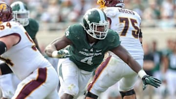 Sep 26, 2015; East Lansing, MI, USA; Michigan State Spartans defensive lineman Malik McDowell (4) breaks though the Central Michigan offensive line during the 2nd half of a game at Spartan Stadium. MSU won 30-10. Mandatory Credit: Mike Carter-USA TODAY Sports