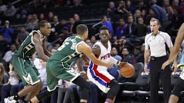 Dec 4, 2015; Auburn Hills, MI, USA; Detroit Pistons guard Reggie Jackson (1) is defended by Milwaukee Bucks guard Michael Carter-Williams (5) and guard Khris Middleton (22) during the fourth quarter at The Palace of Auburn Hills. Pistons win 102-95. Mandatory Credit: Raj Mehta-USA TODAY Sports