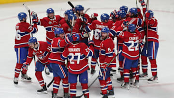 Jul 5, 2021; Montreal, Quebec, CAN; Montreal Canadiens right wing Josh Anderson (17) is congratulated by teammates after scoring the game winning goal against Tampa Bay Lightning goaltender Andrei Vasilevskiy (not pictured) during overtime in game four of the 2021 Stanley Cup Final at Bell Centre. Mandatory Credit: Jean-Yves Ahern-USA TODAY Sports