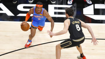 Shai Gilgeous-Alexander #2 of the OKC Thunder drives towards the basket. (Photo by Todd Kirkland/Getty Images)