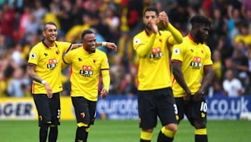 WATFORD, ENGLAND - SEPTEMBER 18: Roberto Pereyra of Watford (L) and Juan Camilo Zuniga of Watford (2L) embrace after the game during the Premier League match between Watford and Manchester United at Vicarage Road on September 18, 2016 in Watford, England. (Photo by Laurence Griffiths/Getty Images)