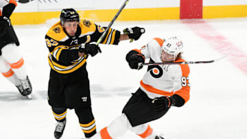 Jan 21, 2021; Boston, Massachusetts, USA; Boston Bruins center Brad Marchand (63) checks Philadelphia Flyers right wing Jakub Voracek (93) during the third period at the TD Garden. Mandatory Credit: Brian Fluharty-USA TODAY Sports