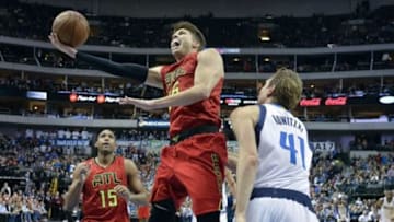 Dec 9, 2015; Dallas, TX, USA; Atlanta Hawks guard Kyle Korver (26) drives to the basket Dallas Mavericks forward Dirk Nowitzki (41) during the second half at the American Airlines Center. The Hawks defeat the Mavericks 98-95. Mandatory Credit: Jerome Miron-USA TODAY Sports
