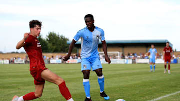RUGBY, ENGLAND - JULY 24: Rhys Williams of Liverpool in action with Brandon Mason of Coventry City during the Pre-Season Friendly match between Coventry City and Liverpool U23 at Butlin Road on July 24, 2019 in Rugby, England. (Photo by Marc Atkins/Getty Images)