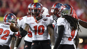 Western Kentucky Hilltoppers defensive lineman DeAngelo Malone (10) celebrates with teammates after intercepting a Louisville Cardinals pass. Mandatory Credit: Jamie Rhodes-USA TODAY Sports