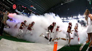 ARLINGTON, TX - DECEMBER 2: The Oklahoma Sooners take the field before playing the TCU Horned Frogs during the first half at AT&T Stadium on December 2, 2017 in Arlington, Texas. OU won 41-17. (Photo by Ron Jenkins/Getty Images)