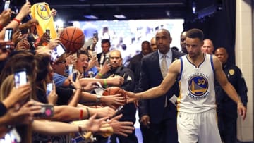Feb 25, 2016; Orlando, FL, USA; Golden State Warriors guard Stephen Curry (30) greets fans in the tunnel after a basketball game against the Orlando Magic at Amway Center. The Warriors won 130-114. Mandatory Credit: Reinhold Matay-USA TODAY Sports