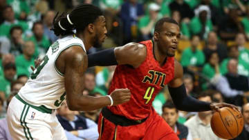 Apr 28, 2016; Boston, MA, USA; Atlanta Hawks forward Paul Millsap (4) drives to the hoop against Boston Celtics forward Jae Crowder (left) during the second half in game six of the first round of the NBA Playoffs at TD Garden. Mandatory Credit: Mark L. Baer-USA TODAY Sports