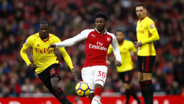 LONDON, ENGLAND - MARCH 11: Ainsley Maitland-Niles of Arsenal holds of Abdoulaye Doucoure of Watford during the Premier League match between Arsenal and Watford at Emirates Stadium on March 11, 2018 in London, England. (Photo by Julian Finney/Getty Images)