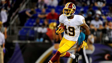 BALTIMORE, MD - AUGUST 23: Wide receiver Rashad Ross #19 of the Washington Redskins brings the ball up field during a preseason game against the Baltimore Ravens at M&T Bank Stadium on August 23, 2014 in Baltimore, Maryland. (Photo by Larry French/Getty Images)