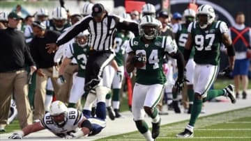 Oct 23, 2011; East Rutherford, NJ, USA; New York Jets cornerback Darrelle Revis (24) returns an interception during the game against the San Diego Chargers at Met Life Stadium. Mandatory Credit: William Perlman/THE STAR-LEDGER via USA TODAY Sports
