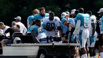 SPARTANBURG, SC - JULY 28: Daryl Williams (60) tackle Carolina Panthers is carried on a cart off the field after an injury to his right leg during the third day of the Carolina Panthers training camp practice at Wofford College July 28, 2018 in Spartanburg, S.C. (Photo by John Byrum/Icon Sportswire via Getty Images)