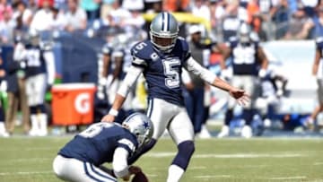 Sep 14, 2014; Nashville, TN, USA; Dallas Cowboys kicker Dan Bailey (5) attempts an extra point against the Tennessee Titans during the second half at LP Field. The Cowboys beat the Titans 26-10. Mandatory Credit: Don McPeak-USA TODAY Sports