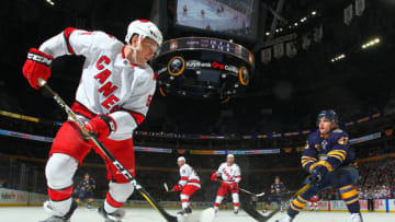 BUFFALO, NY - NOVEMBER 14: Jake Gardiner #51 of the Carolina Hurricanes controls the puck against Conor Sheary #43 of the Buffalo Sabres during an NHL game on November 14, 2019 at KeyBank Center in Buffalo, New York. Carolina won, 5-4 in overtime. (Photo by Bill Wippert/NHLI via Getty Images)