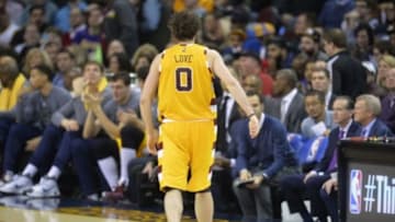 Feb 10, 2016; Cleveland, OH, USA; Cleveland Cavaliers forward Kevin Love (0) walks off the court with an apparent left shoulder injury in the second quarter against the Los Angeles Lakers at Quicken Loans Arena. Mandatory Credit: David Richard-USA TODAY Sports