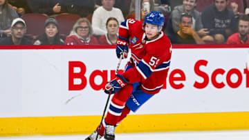Sep 30, 2023; Montreal, Quebec, CAN; Montreal Canadiens defenseman Mattias Norlinder (59) plays the puck against the Toronto Maple Leafs during the second period at Bell Centre. Mandatory Credit: David Kirouac-USA TODAY Sports