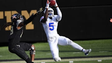Nov 21, 2020; Nashville, Tennessee, USA; Florida Gators defensive back Kaiir Elam (5) intercepts a pass intended for Vanderbilt Commodores wide receiver Chris Pierce Jr. (19) during the second half at Vanderbilt Stadium. Mandatory Credit: Christopher Hanewinckel-USA TODAY Sports