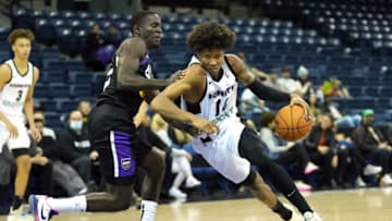 Nov 29, 2021; Stockton, CA, USA; G League Ignite forward MarJon Beauchamp (14) drives while being defended by Stockton Kings guard Damien Jefferson (22) during the third quarter at Stockton Arena. Mandatory Credit: Darren Yamashita-USA TODAY Sports