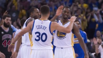November 20, 2015; Oakland, CA, USA; Golden State Warriors guard Andre Iguodala (9), guard Stephen Curry (30), and forward Harrison Barnes (40) celebrate during the fourth quarter against the Chicago Bulls at Oracle Arena. The Warriors defeated the Bulls 106-94. Mandatory Credit: Kyle Terada-USA TODAY Sports