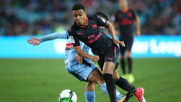 SYDNEY, AUSTRALIA - JULY 13: Donyell Malen of Arsenal is tackled during the match between Sydney FC and Arsenal FC at ANZ Stadium on July 13, 2017 in Sydney, Australia. (Photo by Mark Metcalfe/Getty Images)