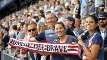 Jul 31, 2013; Kansas City, KS, USA; MLS fans hold up a patriotic scarf before the 2013 MLS All Star Game at Sporting Park. Mandatory Credit: Denny Medley-USA TODAY Sports