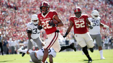 Oct 19, 2019; Norman, OK, USA; Oklahoma Sooners running back Kennedy Brooks (26) scores a touchdown during the second quarter against the West Virginia Mountaineers at Gaylord Family - Oklahoma Memorial Stadium. Mandatory Credit: Kevin Jairaj-USA TODAY Sports