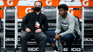 This isn't Chris Finch, it's the man who hired him, Minnesota Timberwolves President of Basketball Operations Gersson Rosas and rookie Anthony Edwards. (Photo by Steph Chambers/Getty Images)