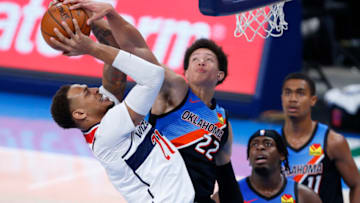 Apr 23, 2021; Oklahoma City, Oklahoma, USA; Oklahoma City Thunder center Isaiah Roby (22) blocks and fouls Washington Wizards center Daniel Gafford (21) during the third quarter at Chesapeake Energy Arena. Mandatory Credit: Alonzo Adams-USA TODAY Sports