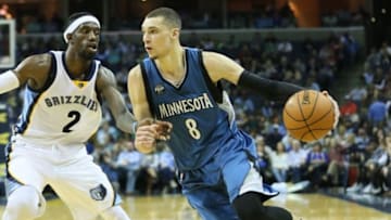 Mar 16, 2016; Memphis, TN, USA; Minnesota Timberwolves guard Zach LaVine (8) dribbles as Memphis Grizzlies guard Briante Weber (2) defends at FedExForum. Minnesota defeated Memphis 114-108. Mandatory Credit: Nelson Chenault-USA TODAY Sports