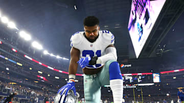 ARLINGTON, TX - DECEMBER 26: Ezekiel Elliott #21 of the Dallas Cowboys takes a knee in the end zone before the Cowboys played the Detroit Lions at AT&T Stadium on December 26, 2016 in Arlington, Texas. (Photo by Tom Pennington/Getty Images)