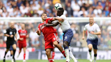 LONDON, ENGLAND - AUGUST 18: Aleksandar Mitrovic of Fulham and Davinson Sanchez of Tottenham Hotspur battle for the ball during the Premier League match between Tottenham Hotspur and Fulham FC at Wembley Stadium on August 18, 2018 in London, United Kingdom. (Photo by Dan Istitene/Getty Images)