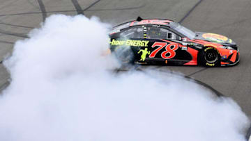 LONG POND, PA - JUNE 03: Martin Truex Jr., driver of the #78 Bass Pro Shops/5-hour ENERGY Toyota, celebrates with a burnout after winning the Monster Energy NASCAR Cup Series Pocono 400 at Pocono Raceway on June 3, 2018 in Long Pond, Pennsylvania. (Photo by Jared C. Tilton/Getty Images)