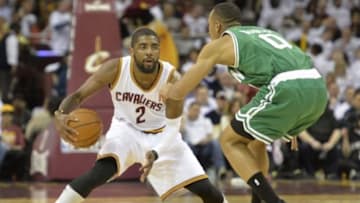 Apr 21, 2015; Cleveland, OH, USA; Cleveland Cavaliers guard Kyrie Irving (2) dribbles against Boston Celtics guard Avery Bradley (0) in the first quarter in game two of the first round of the NBA Playoffs at Quicken Loans Arena. Mandatory Credit: David Richard-USA TODAY Sports