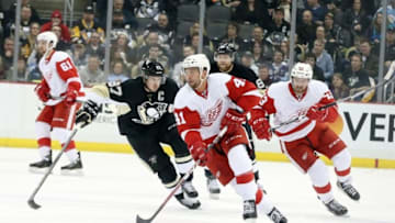 Feb 18, 2016; Pittsburgh, PA, USA; Detroit Red Wings center Luke Glendening (41) skates up ice with the puck against the Pittsburgh Penguins during the third period at the CONSOL Energy Center. The Penguins won 6-3. Mandatory Credit: Charles LeClaire-USA TODAY Sports
