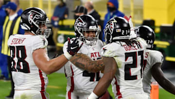 GREEN BAY, WISCONSIN - OCTOBER 05: Todd Gurley #21 of the Atlanta Falcons celebrates after scoring a touchdown in the second half against the Green Bay Packers at Lambeau Field on October 05, 2020 in Green Bay, Wisconsin. (Photo by Quinn Harris/Getty Images)